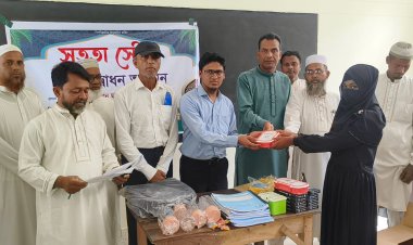 নওগাঁয় ‘সততা স্টোর’ উদ্বোধন ও শিক্ষা উপকরণ বিতরণ